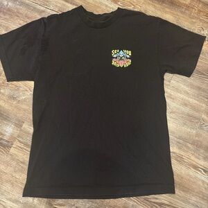 Black Graphic Tee with Small Colorful Chest Print